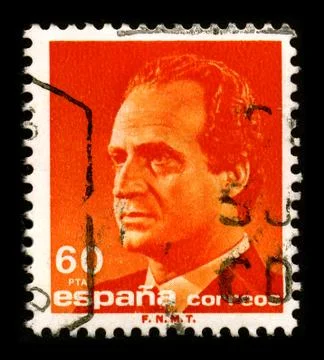 Old postage stamp on a black background. Stock Photos