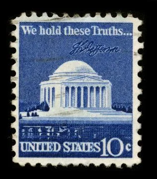 Old postage stamp on a black background. 스톡 사진