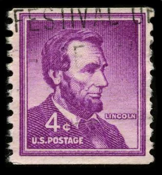 Old postage stamp on a black background. Stock Photos