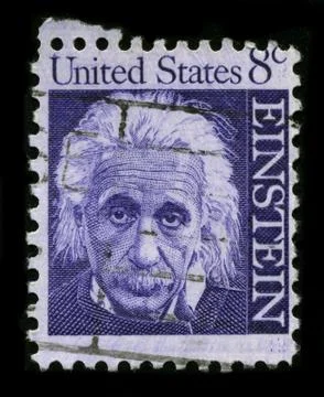 Old postage stamp on a black background. Stock Photos