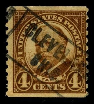 Old postage stamp on a black background. 스톡 사진