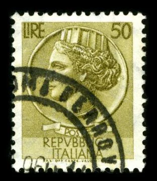Old postage stamp on a black background. 스톡 사진