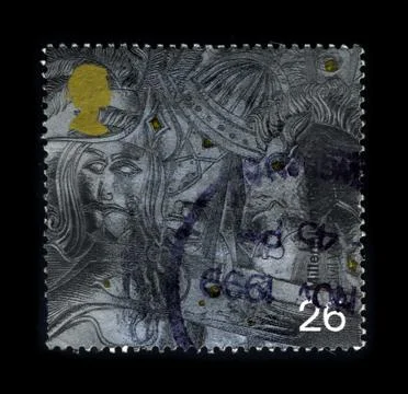 Old postage stamp on a black background. Stock Photos