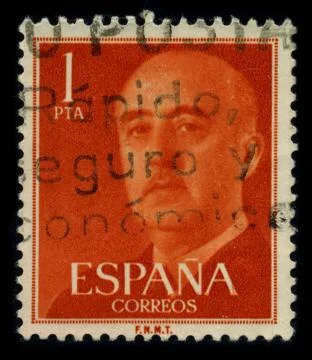 Old postage stamp on a black background. 스톡 사진
