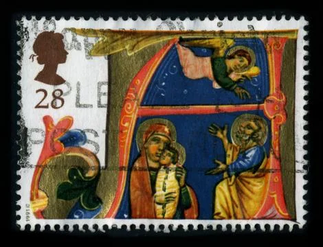 Old postage stamp on a black background. 스톡 사진