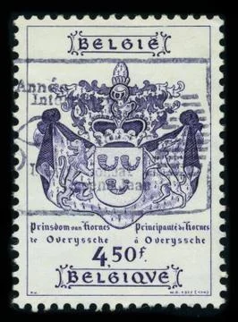Old postage stamp on a black background. Stock Photos
