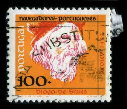 Old postage stamp on a black background. Stock Photos