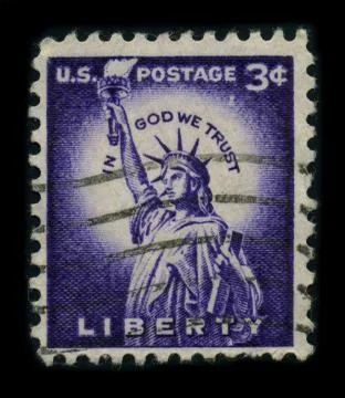Old postage stamp on a black background. 스톡 사진
