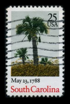 Old postage stamp on a black background. 스톡 사진