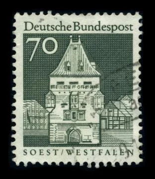 Old postage stamp on a black background. Stock-Fotos