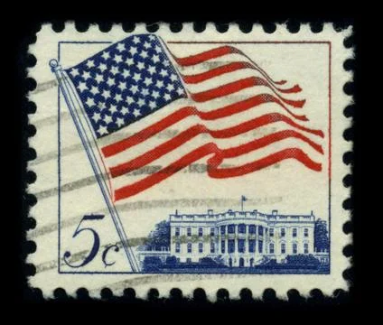 Old postage stamp on a black background. 写真素材