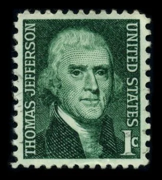 Old postage stamp on a black background. Stock Photos