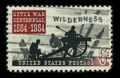 Old postage stamp on a black background. 스톡 사진