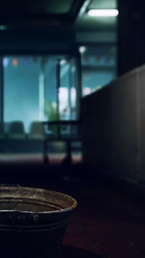 Old pot sitting on floor in empty room with glass windows at night Stock Footage 342185042