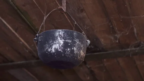 Old pot in a web suspended from wooden planks Stock Footage 102236853