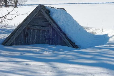 An old potato cellar under deep snow. Stock Photos