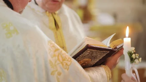 Old prayer book. Baptism or wedding in the church during prayer. Spirituality Stock Footage 196004636