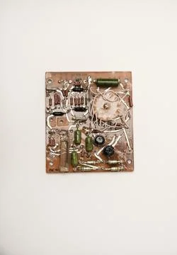 An old printed circuit board with microelements. Semiconductor elements in .. Stock Photos