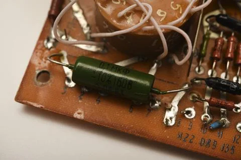 An old printed circuit board with microelements. Semiconductor elements in .. 스톡 사진