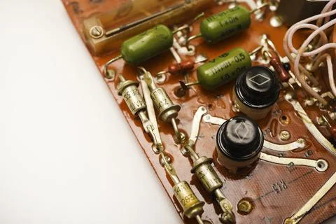 An old printed circuit board with microelements. Semiconductor elements in .. 스톡 사진