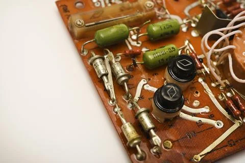 An old printed circuit board with microelements. Semiconductor elements in .. 스톡 사진