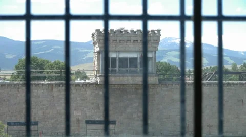 Old prison guard tower through bars Stock Footage 8836224