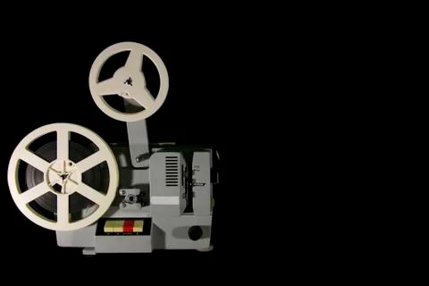 Old projector on a black background Stock Photos