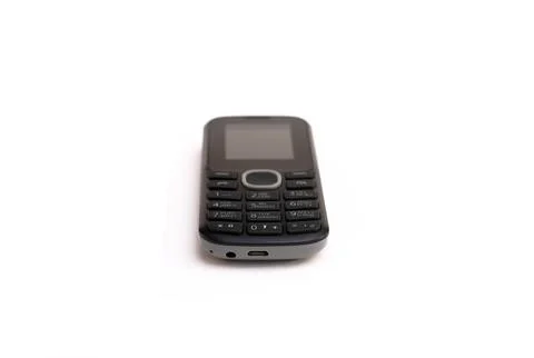 Old push-button telephone on a white background. Stock Photos