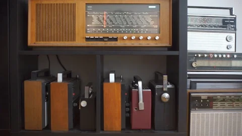 Old radios compiled on a cabinet shelf Stock-Footage 115079705