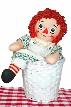 Old rag doll in basket Stock Illustration
