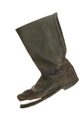 Old ragged rough leather boot Isolated on a white background. Stock Photos