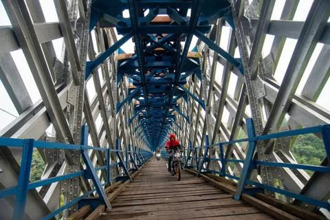  OLD RAILROAD BRIDGE IN WEST JAVA Motorcyclists cross the Cirahong bridge ... Photos