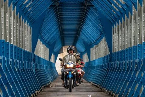  OLD RAILROAD BRIDGE IN WEST JAVA Motorcyclists cross the Cirahong bridge ... Photos