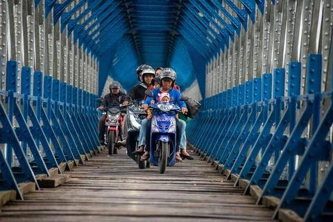  OLD RAILROAD BRIDGE IN WEST JAVA Motorcyclists cross the Cirahong bridge ... Photos