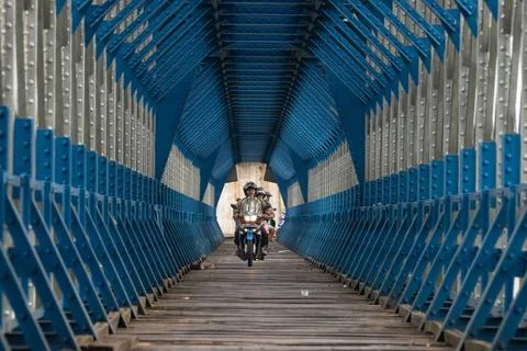  OLD RAILROAD BRIDGE IN WEST JAVA Motorcyclists cross the Cirahong bridge ... Photos