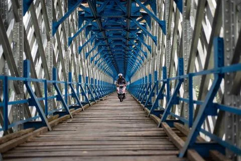  OLD RAILROAD BRIDGE IN WEST JAVA Motorcyclists cross the Cirahong bridge ... Photos