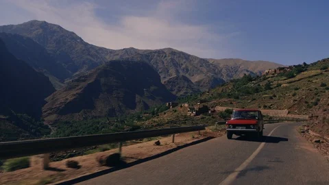 Old Range Rover drives on Mountain Roads in Morocco Stock Footage 124464732