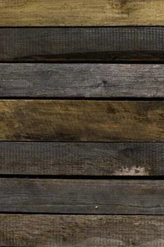 Old, raw boards arranged in a row. Stock Photos