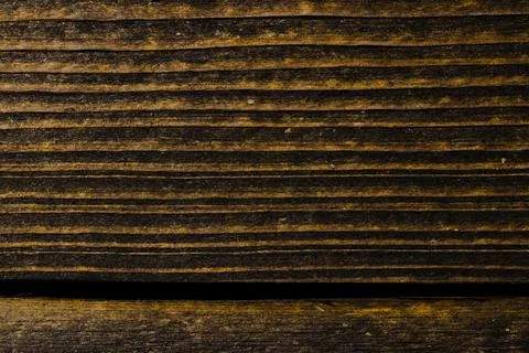 Old, raw boards arranged in a row. Stock Photos