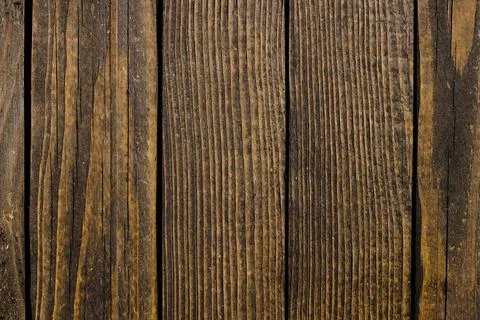 Old, raw boards arranged in a row. Stock Photos