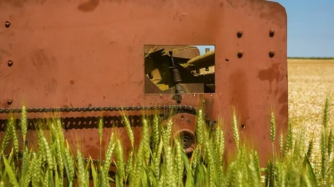 The old reaping machine was prepared and repaired for harvesting wheat Stock Footage 91654209