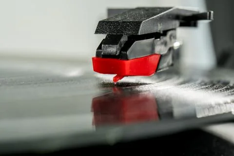 Old record player stylus on a rotating disc, vintage. Stock Photos