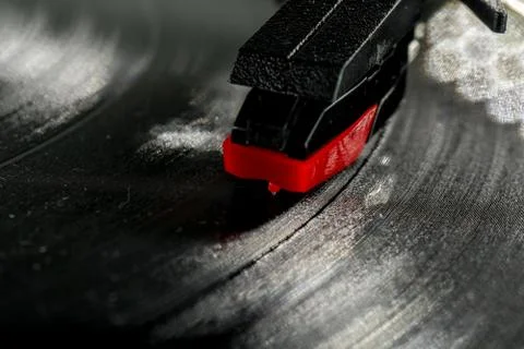 Old record player stylus on a rotating disc, vintage. Stock Photos