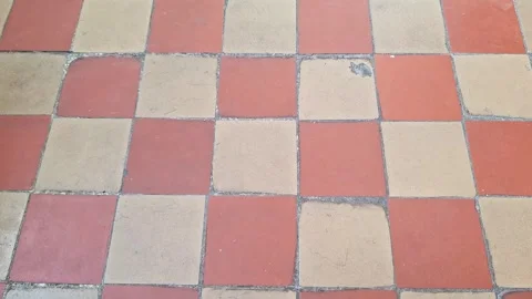 Old Red and Beige Tiled Pavement with Geometric Checker Pattern Stock Footage 339758792