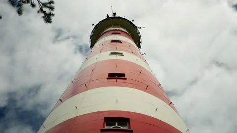 Old red and white lighthouse perspective view from below Stock Footage 136935809