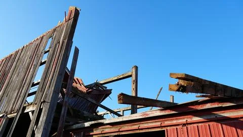 Old Red Barn Fallen Due To Climate Change Stock Photos
