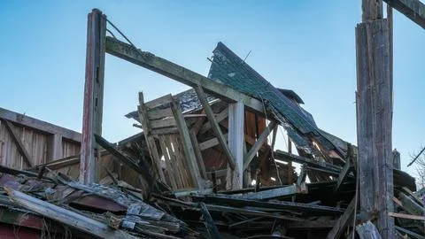Old Red Barn Fallen Due To Climate Change Stock Photos
