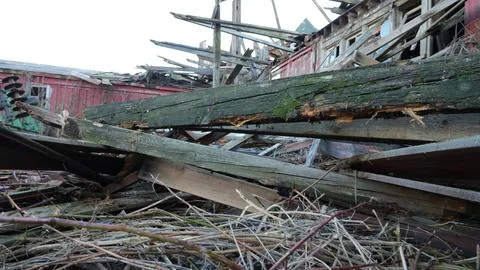 Old Red Barn Fallen Due To Climate Change Stock Photos