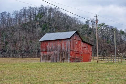 Old red barn in the mountains Stock Photos