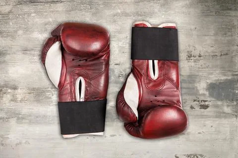 Old red boxing gloves Stock Photos